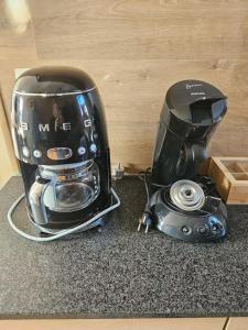 a blender sitting on a counter next to a toaster at Appartement cosy 2 chambres in Wenduine