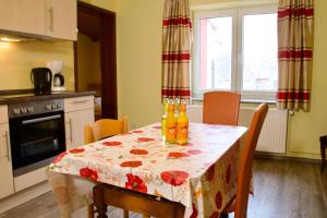 a kitchen with a table with drinks on it at Seetuun-Hoff - Dree in Nordstrand