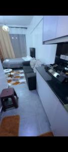 a kitchen with a stove and a counter top at Tembea Stays in Kiambaa