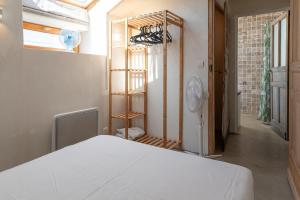 a room with a bed and a room with a closet at La Terrasse in Patrimonio +18 photos