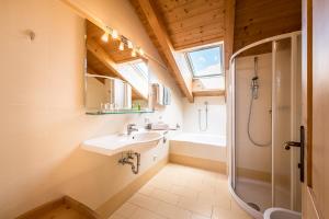 a bathroom with a sink and a shower at Residence Walder in Falzes +90 photos