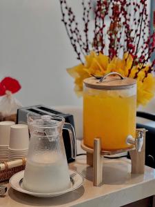 a counter top with a blender and a drink at ANNA Boutique Villa - Sea View in Phan Thiet +21 photos
