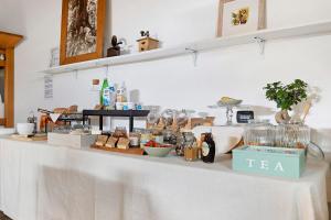 a white counter with glasses and other items on it at Tenuta I Maroneri in Drena