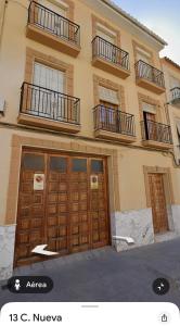 a building with two sets of doors on it at Casa Magdalena in Archidona