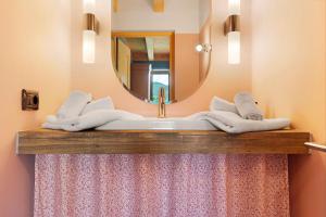 a bathroom with a sink with a mirror and towels at Tenuta I Maroneri in Drena +52 photos