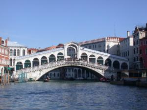 a bridge over a body of water with buildings at Scalon del Doge in Venice