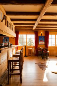 a dining room with tables and chairs in a cabin at Mountain Lodge & Spa, Les Crosets in Les Crosets