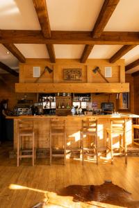 a bar in a room with wooden ceilings at Mountain Lodge & Spa, Les Crosets in Les Crosets