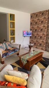 a living room with a couch and a table at Beach Village Rest in Tarrafal
