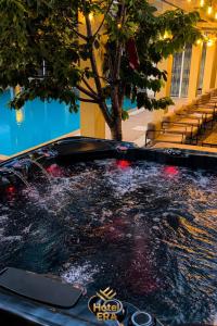 a pool of water in the middle of a building at Hotel ERA in Prishtinë