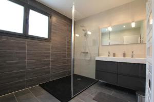 a bathroom with a shower and a sink at Iduzki-alde bi in Souraïde +23 photos