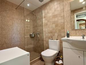 a bathroom with a toilet and a shower and a sink at Casa do Castelo by CORAL in Silves +35 photos