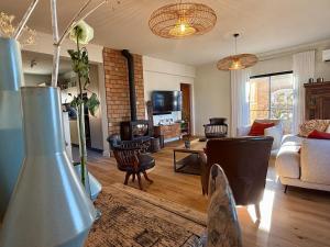 a living room with a couch and a table at Casa do Castelo by CORAL in Silves