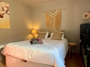 a bedroom with a white bed with pillows on it at Casa do Castelo by CORAL in Silves