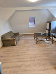 a living room with a couch and a table at Wanderlust in Bisingen