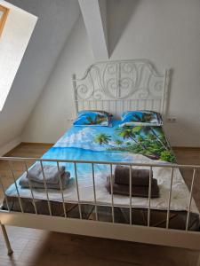 a bedroom with a bed with a metal railing at Wanderlust in Bisingen