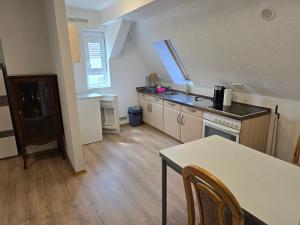 a kitchen with a table and a counter top at Wanderlust in Bisingen