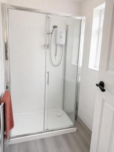 a shower with a glass enclosure in a bathroom at 2BR Mariners Stay - Newhaven in Newhaven