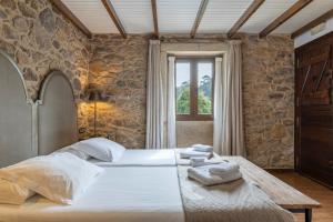 Llit o llits en una habitació de Hotel Rustico Lugar Do Cotariño