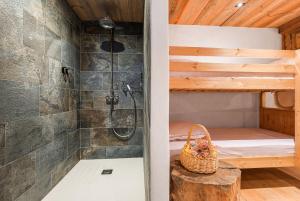 a bathroom with a shower and a bunk bed at La Ferme 1828 in Demi-Quartier +32 photos