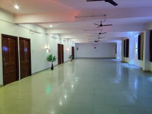 an empty hallway with white walls and a ceiling at hotel gsa & guest house in Haridwār
