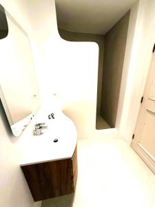 a bathroom with a sink and a mirror at GG Luxury Apartments - Porto Cervo - Costa Smeralda in Porto Cervo +8 photos