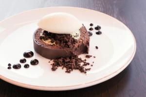 a piece of chocolate cake on a white plate at Montcalm Royal London House, London City in London