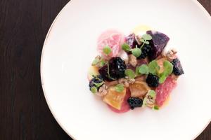 a white plate of food with fruit on it at Montcalm Royal London House, London City in London