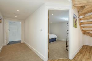 a hallway with a door leading to a bedroom at 1 Bed in Barrow oc-b42640 in Barrow