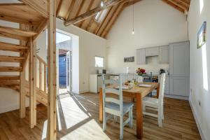 a kitchen and dining room with a table and chairs at 1 Bed in Barrow oc-b42640 in Barrow