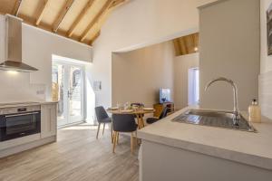 a kitchen with a sink and a table with chairs at 2 Bed in Barrow oc-b42642 in Barrow