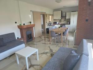 a living room with a couch and a table at Apartman Max in Sveti Ivan Zelina