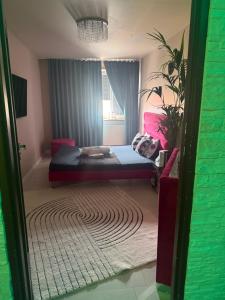 a bedroom with a bed in a room with a rug at Krakowska in Tarnów