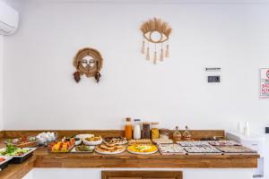 a kitchen counter with many plates of food on it at Costa Viva Bodrum in Bodrum City