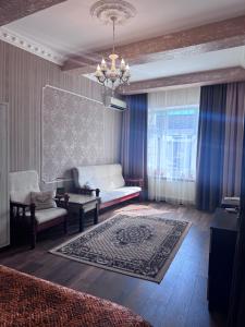 a living room with a bed and a couch at Liders17 in Odesa