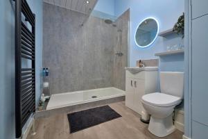 a bathroom with a toilet and a shower at Finest Retreats - Delfryn in Talysarn +19 photos