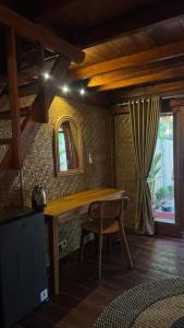 a wooden table in a room with a mirror at Alibaba Bungalows in Gili Islands