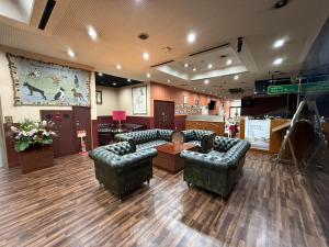 a lobby with couches and a table in a store at HOTEL Dane&Kerry DogResort in Ishioka +14 photos