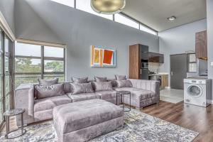 a living room with a couch and a table at The Link Sandton Apartment in Johannesburg