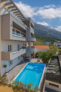 an image of a house with a swimming pool at Villa Collis in Makarska