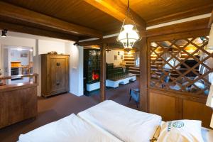 a bedroom with a bed in a room with a wooden ceiling at Cibulka in Horní Malá Úpa