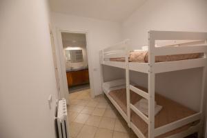 a room with two bunk beds and a hallway at Dimora del Murattiano in Monopoli