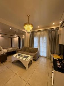 a living room with a couch and a coffee table at Casa Pajaros in Calangute