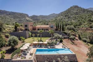 an aerial view of a house with a swimming pool at Son Bunyola Resort and Villas in Banyalbufar