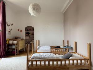 a bedroom with two beds in a room at Villa élégante 5 chambres - 24H du Mans - Piscine Chauffée & Garage in Le Mans +24 photos