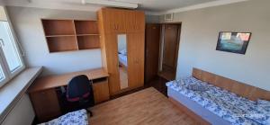 a small room with a bed and a desk at Dom Studenta PUZ w Suwałkach in Suwałki +22 photos