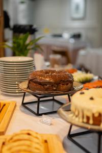 a chocolate cake on a plate on a table at Biazi Plaza Hotel Bauru in Bauru