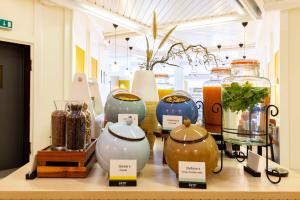 a group of vases on a shelf in a room at Hotel Continental Frankfurt in Frankfurt