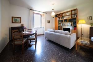 a living room with a couch and a table at Casa Natalina in Montecatini Terme