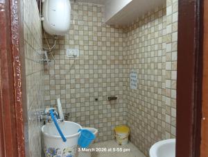 a small bathroom with a toilet and a sink at HOTEL MALOOK A blink away from Mall Road in Shimla